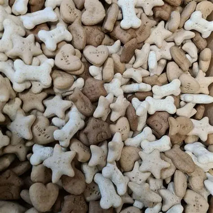 Assorted dog treats in bone, star, and heart shapes.